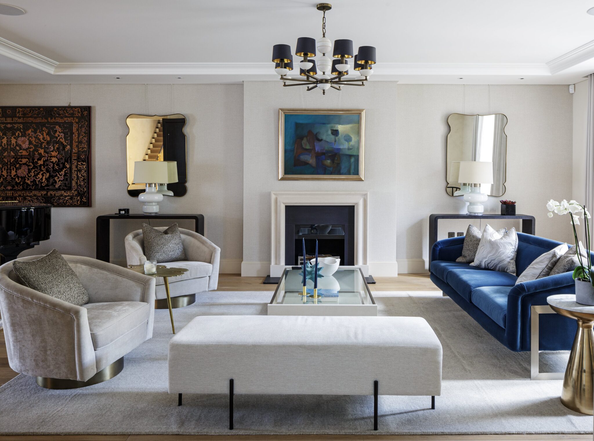 Schneider Designers LLP — Reception room with green velvet sofa and marble fireplace in a Holland Park villa renovation