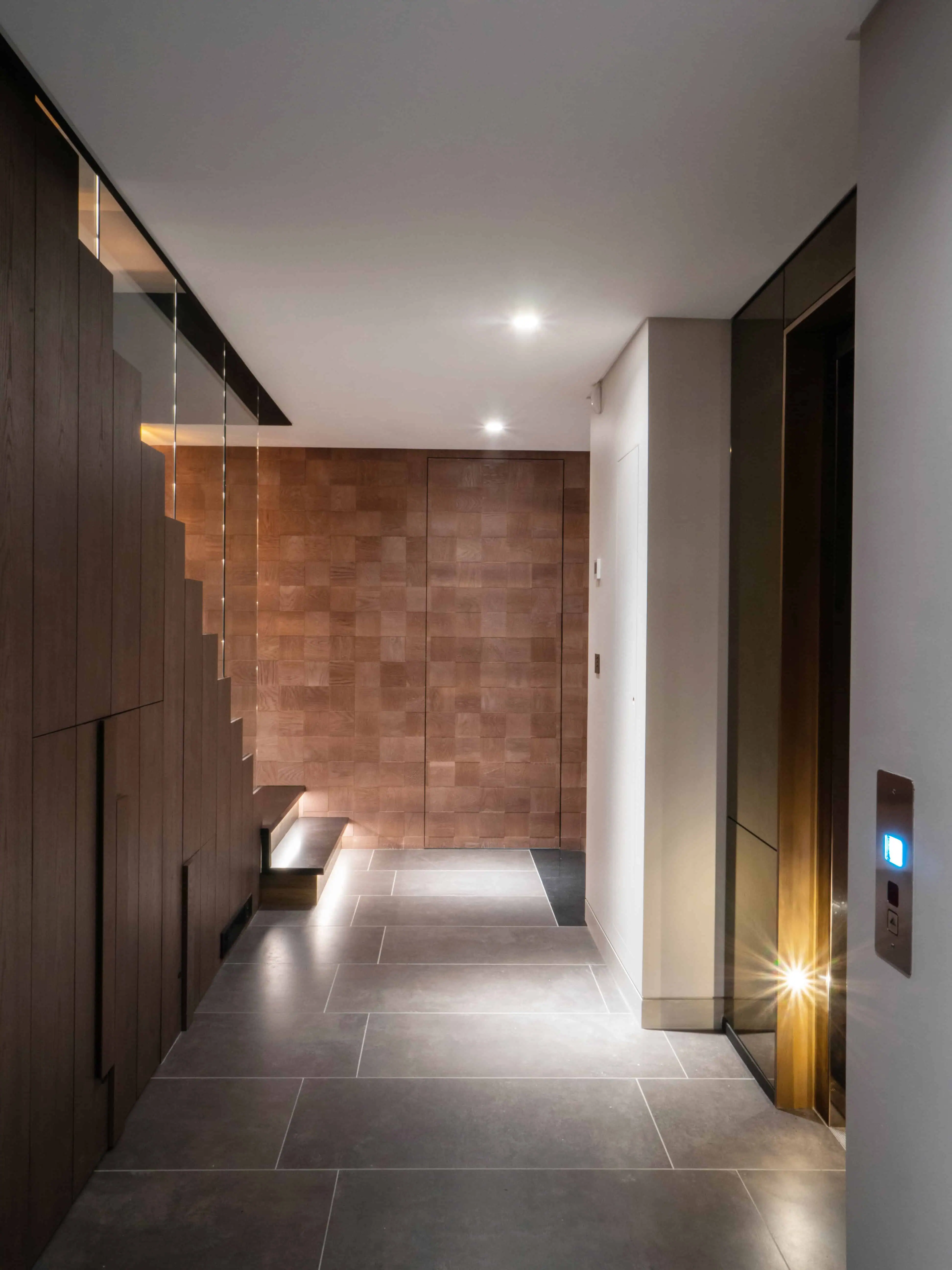 Minimalist basement corridor with concealed lighting and refined architectural detailing.