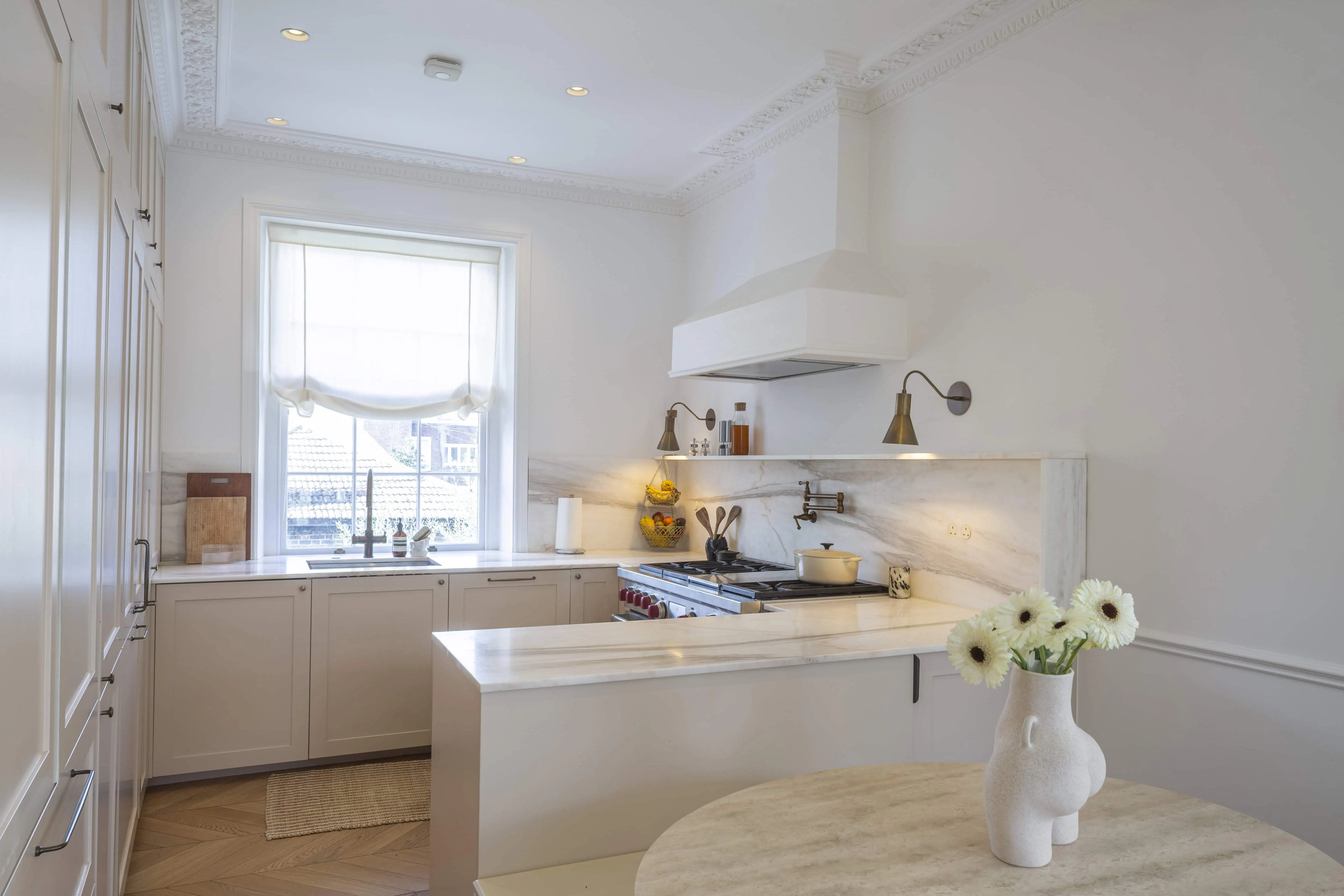 Kitchen with white cabinetry in Victorian maisonette renovation, Primrose Hill