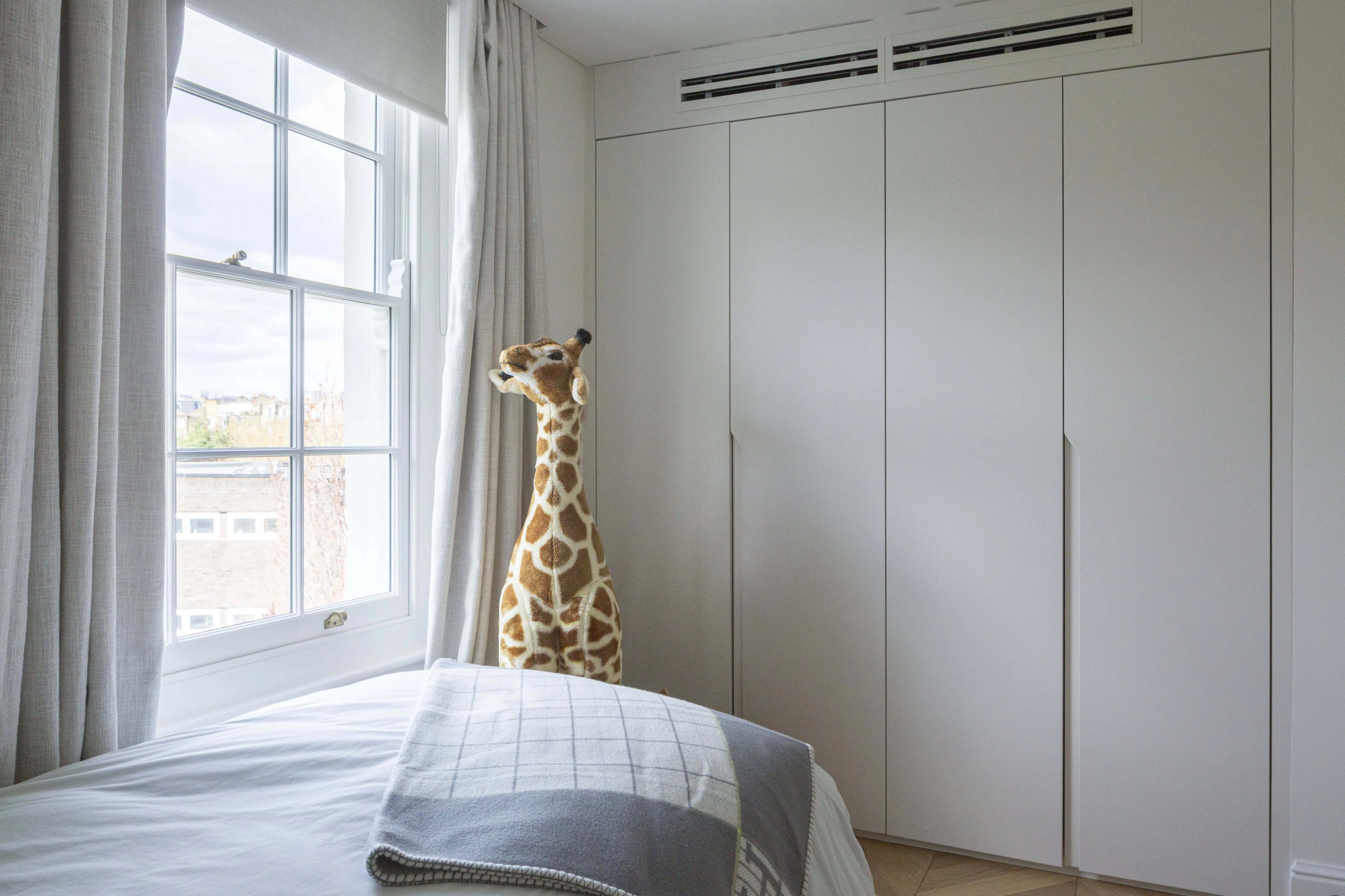 Bedroom with fitted wardrobes in Victorian maisonette renovation, Primrose Hill