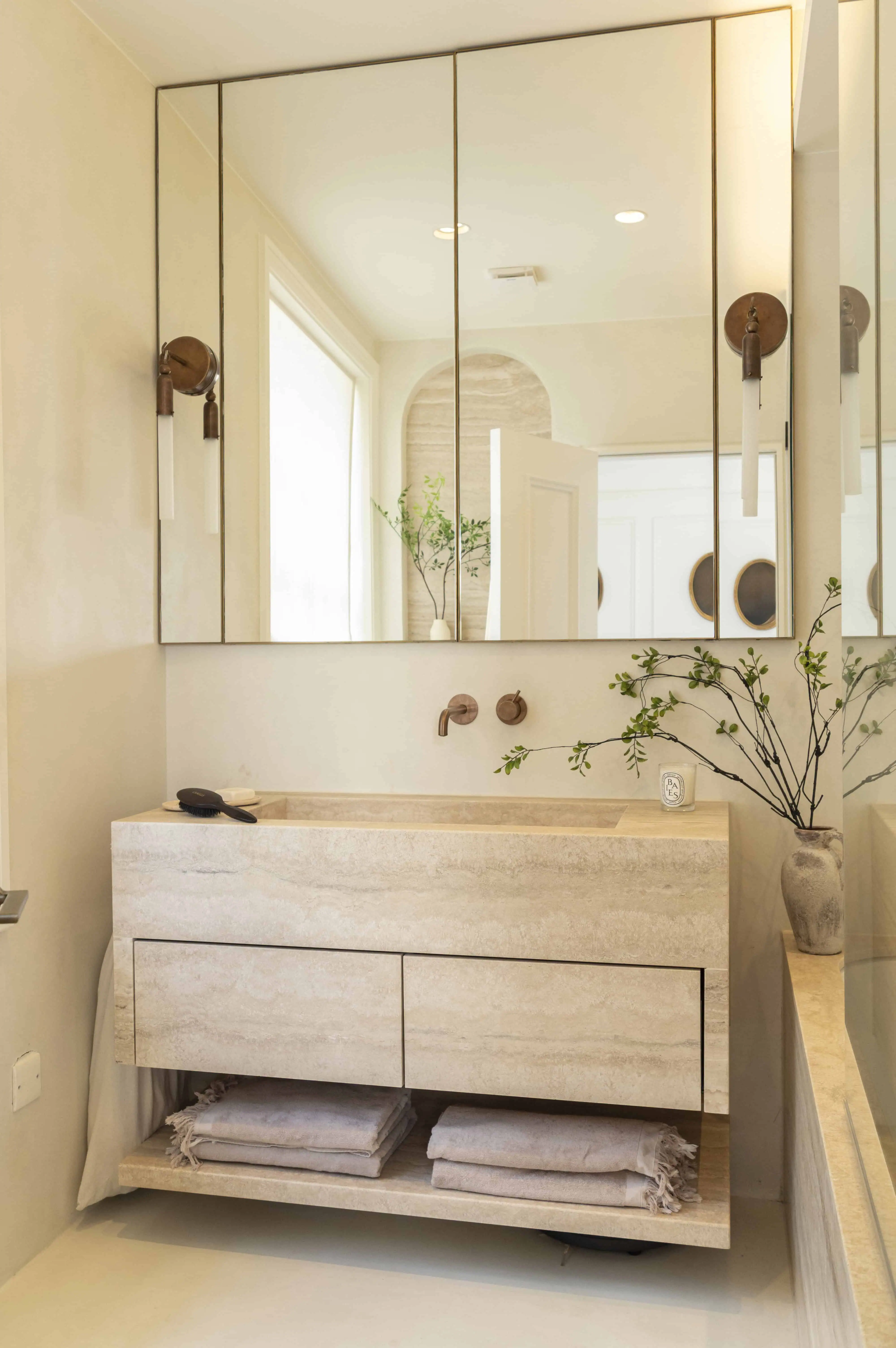 En-suite bathroom vanity with mirrored cabinet in Victorian maisonette renovation, Primrose Hill