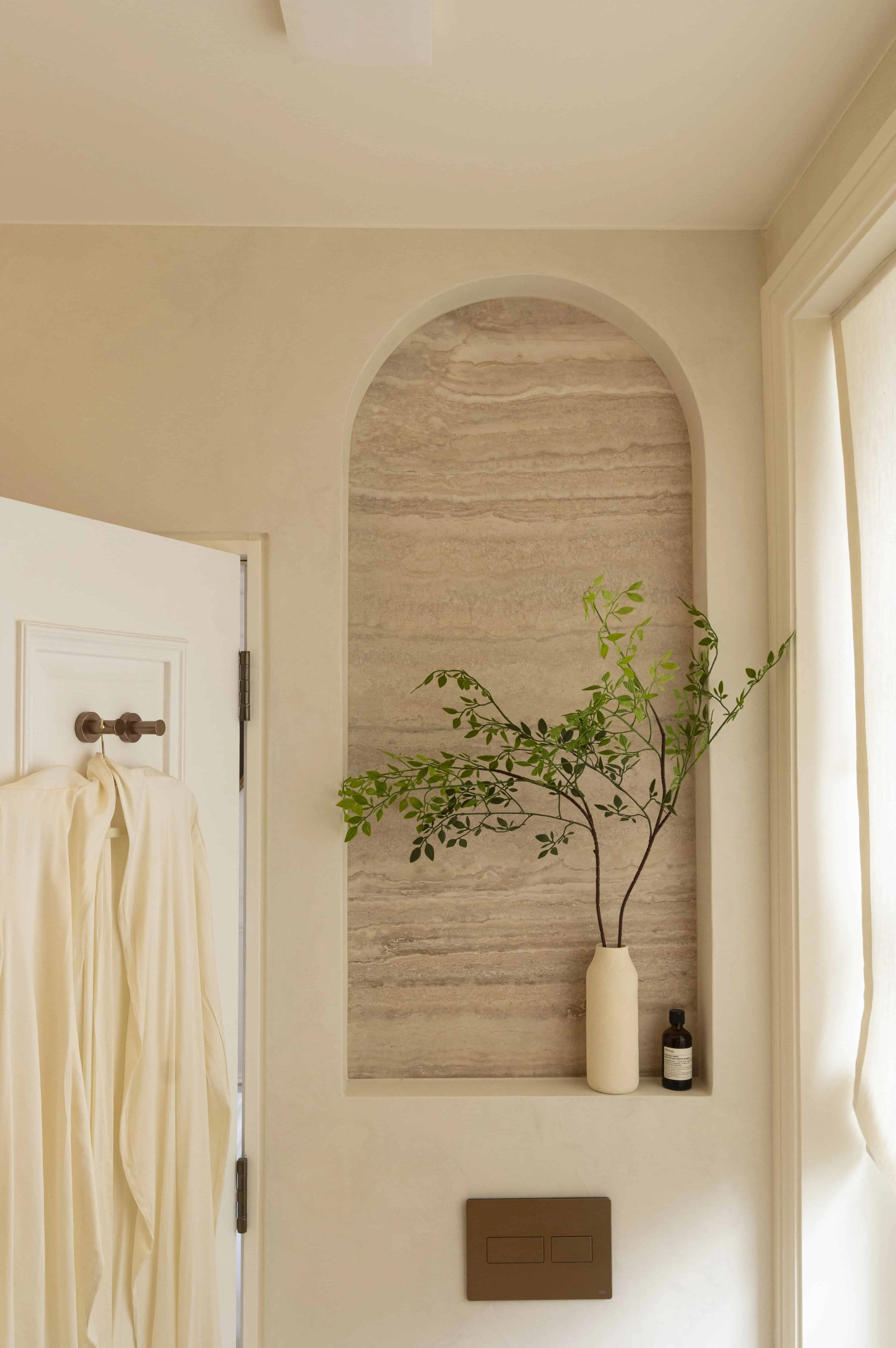 Bathroom with arched storage niche in Victorian maisonette renovation, Primrose Hill