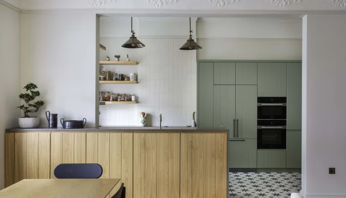 Pendant light and modern dining table in period setting in Belsize Park flat